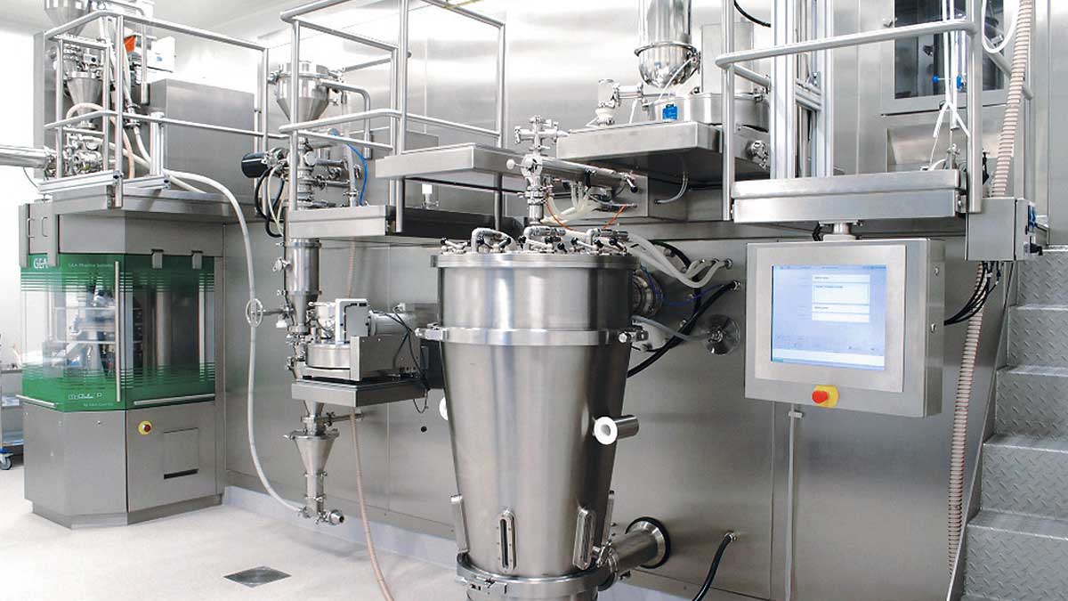 Automated processing equipment at a pharmaceutical manufacturing facility